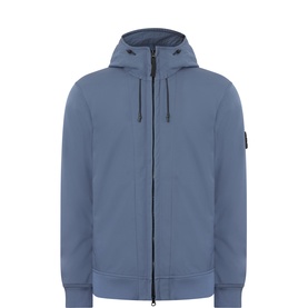 Stone Island slate blue casual jacket with zip fastening, drawstring hood, ribbed cuffs and hem, and signature arm badge.