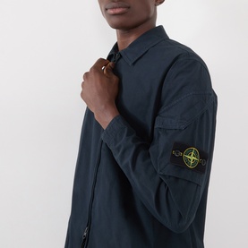 Model wearing Stone Island navy blue cotton casual shirt with zip collar and signature compass badge on sleeve