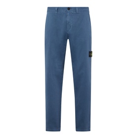 Stone Island Blu Ardesia casual trousers in cotton-elastane, slim fit with signature compass badge patch on left leg.