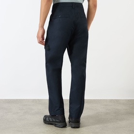 Model wearing Stone Island blue cotton cargo-style chinos, shown from behind, with side pocket detail and relaxed straight leg fit.