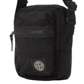 Stone Island black nylon crossbody bag with front zip pocket, mesh detail, and signature compass rose badge patch.