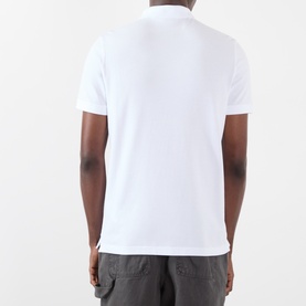 Model wearing Stone Island white polo shirt, rear view, paired with grey cargo trousers. Short sleeves, stretch cotton fabric.
