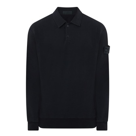 Stone Island black long-sleeve polo shirt with three-button placket, ribbed cuffs, and signature sleeve badge patch.