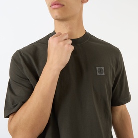 Model wearing Stone Island Compass Logo T-Shirt in coal grey with tonal logo patch, crew neck, short sleeves, relaxed fit.