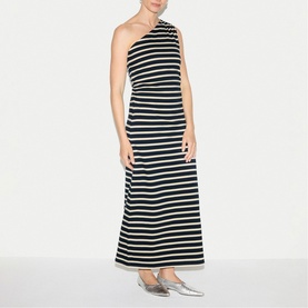 Model wearing Jigsaw navy stripe one-shoulder maxi dress, styled with silver flat shoes