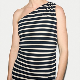 Model wearing Jigsaw navy and cream horizontal stripe one-shoulder top with ruched shoulder detail