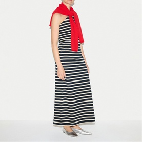Model wearing Jigsaw navy and white horizontal stripe maxi dress, styled with a red scarf and silver flat shoes.