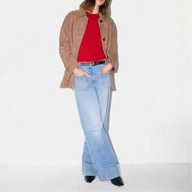 Model wearing Jigsaw light brown textured overshirt jacket with red top, light blue wide-leg jeans and black belt.