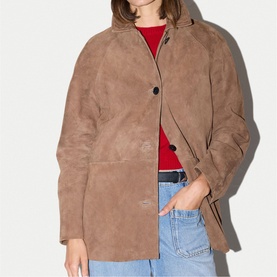 Model wearing Jigsaw light brown suede jacket, styled with red top and light blue jeans