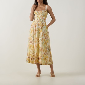 Model wearing Bardot Adaline Floral Print Dress in Yellow Floral, midi-length with sweetheart neckline, wide straps and flared skirt, styled with