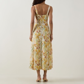 Model wearing Bardot Adaline Floral Print Dress in yellow floral, showing rear zip, wide straps, structured bodice and flared midi skirt.