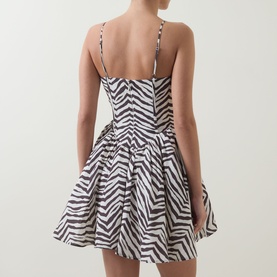 Model wearing Bardot Ashta Corset Printed Mini Dress in brown zebra print, back view showing shirred panels, adjustable straps and voluminous skirt.