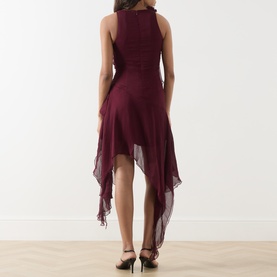 Model wearing Bardot Ivana Textured Mini Dress in deep plum, showing back view with high-low hemline, circle-cut ruffles and babylock edging.