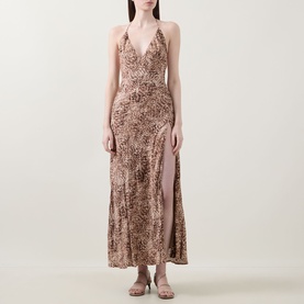 Model wearing Bardot Lizbeth Leopard Slip Dress in leopard print, maxi length with V-neckline, halter back, and high side split.