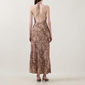 Model wearing Bardot Lizbeth Leopard Slip Dress in leopard print, showing open back with halter tie detail and maxi-length flared skirt.