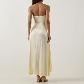 Model wearing Bardot Lorenzo Asymmetric Off-The-Shoulder Dress in yellow satin, showing rear zip, gathered bodice and asymmetric midi skirt.