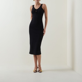 Model wearing Bardot Mason Ribbed Dress in black, midi-length ribbed fabric with plunging neckline, wide straps and centre-front hardware detail,