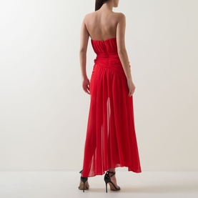 Model wearing Bardot Remalia Gathered Mini Dress in Fire Red, strapless with gathered panel overlay, styled with black strappy heels.