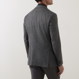 Model wearing Corneliani grey green virgin wool jacket, rear view, styled with matching trousers