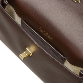 Lauren chestnut brown nappa leather crossbody bag, close-up of interior lining and gold-tone clasp hardware detail