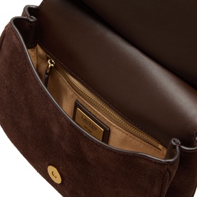 Lauren Marcy Charm Crossbody Bag in chestnut brown suede leather, open interior view showing tan lining, zip pocket and gold-tone hardware detail.