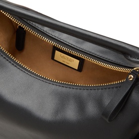 Lauren black leather shoulder bag interior view showing tan suede lining, gold-tone zip and branded label