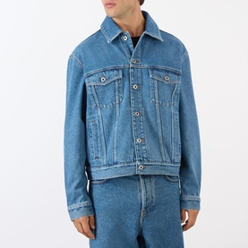 Model wearing Loewe Anagram Logo Denim Jacket in jeans blue, mid-wash cotton denim with chest flap pockets and front button fastening.