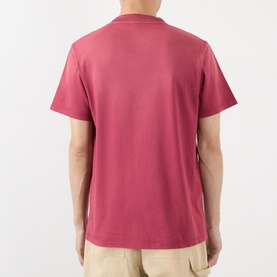 Model wearing Loewe red cotton T-shirt, rear view, short sleeves, relaxed fit, styled with beige trousers