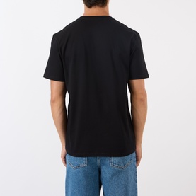 Model wearing Loewe black crew neck T-shirt, back view, styled with blue jeans
