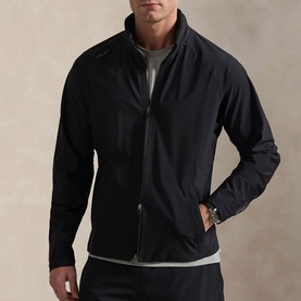 Model wearing RLX Golf black casual jacket with zip fastening and side pockets, styled with grey crew-neck top