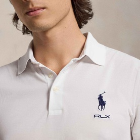 Model wearing RLX Golf polo shirt in light green, featuring navy big pony logo embroidery and classic collar, close-up detail shot