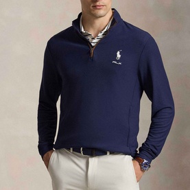 Model wearing RLX Golf Pony Logo Mesh Quarter-Zip Sweatshirt in Refined Navy, styled with striped collar and white trousers.