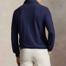 Model wearing RLX Golf Pony Logo Mesh Quarter-Zip Sweatshirt in Refined Navy, back view, styled with cream trousers