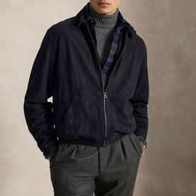 Model wearing Ralph Lauren Collection Navy casual jacket, zip front, over plaid shirt and grey turtleneck, styled with grey trousers