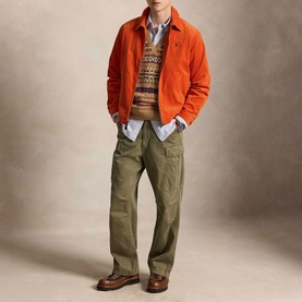 Model wearing Ralph Lauren College Orange casual jacket, styled with fair isle knit, olive cargo trousers and brown leather boots.