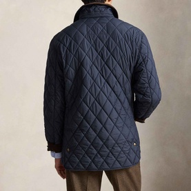 Model wearing Ralph Lauren navy quilted casual jacket, shown from the back with diamond quilting pattern and shirt collar visible.