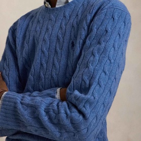 Model wearing Ralph Lauren cable-knit crew neck jumper in Turquoise Jay Heather, styled with a collared shirt underneath