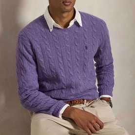 Model wearing Ralph Lauren Pony Logo Cable Knitted Sweater in light coronet purple heather, styled with white shirt and chinos.