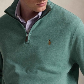 Model wearing Ralph Lauren pine heather quarter-zip sweatshirt with signature pony logo, styled over a lilac collared shirt.