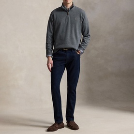 Model wearing Ralph Lauren Barclay Heather quarter-zip sweatshirt, styled with navy trousers and brown suede loafers.