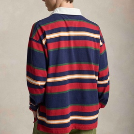 Model wearing Ralph Lauren Pony Logo Striped Rugby Shirt in Newport Navy Multi, rear view showing multicolour horizontal stripes and twill collar.