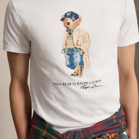 Model wearing Ralph Lauren Polo Bear Custom Slim Fit T-Shirt in white with crew neck and Polo Bear graphic print on chest.