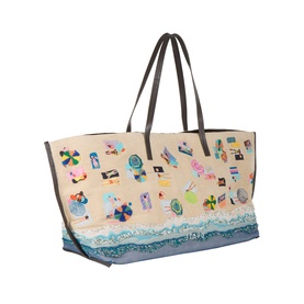 Staud Beach Day tote in beige jute with beach scene print, dark leather handles, and blue wave detail along the base.