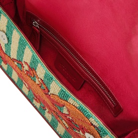 Staud Summer Lobster shoulder bag open interior view, hot pink lining with zip pocket, beaded lobster exterior detail visible