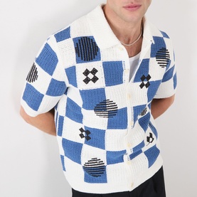 Model wearing Wax London Porto Printed Cardigan in ecru and blue checkerboard knit with polo collar and short sleeves