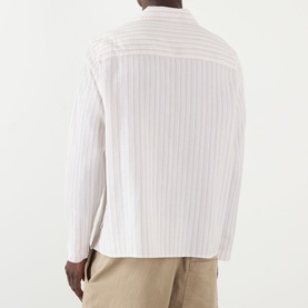 Model wearing Wax London Corey Striped Shirt in Natural, rear view, long sleeves, styled with beige trousers.
