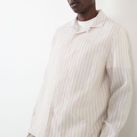 Model wearing Wax London Corey Striped Shirt in Natural, featuring long sleeves, pointed collar and vertical stripe pattern, styled with white