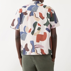 Model wearing Wax London Didcot Abstract Print Shirt in ecru and multi, short sleeves, styled with olive trousers, rear view