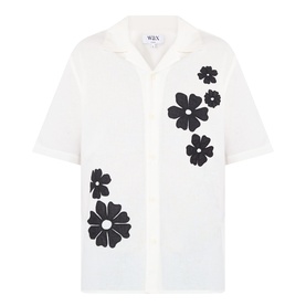 Wax London Didcot Floral Shirt in ecru and black with camp collar, short sleeves, and bold black floral appliqu&eacute; embroideries on front.