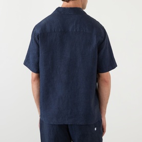 Model wearing Wax London navy linen casual shirt, short sleeves, back view, styled with matching navy trousers
